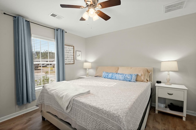 bedroom featuring ceiling fan and dark hardwood / wood-style floors