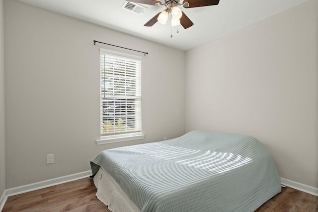 bedroom with wood-type flooring and ceiling fan