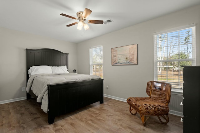 bedroom with hardwood / wood-style flooring and ceiling fan