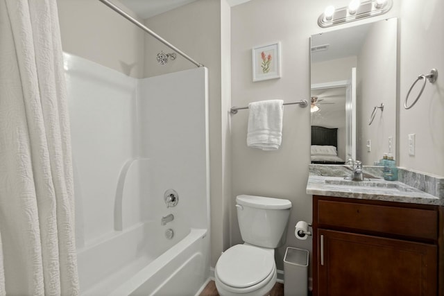 full bathroom with ceiling fan, shower / bath combination with curtain, toilet, and vanity