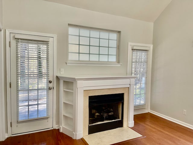 unfurnished living room with hardwood / wood-style flooring