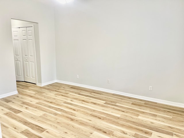 unfurnished room featuring light hardwood / wood-style floors