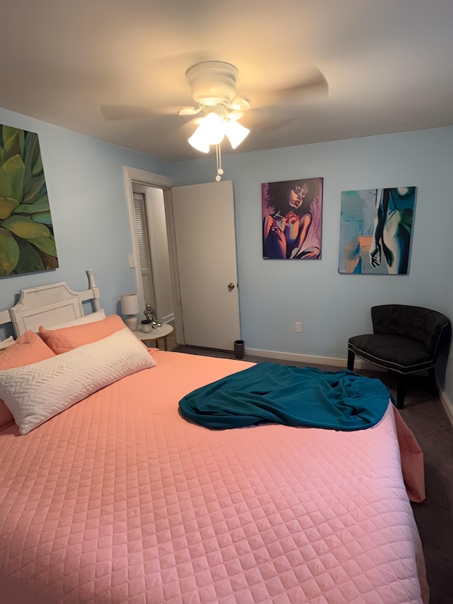 bedroom featuring ceiling fan and carpet