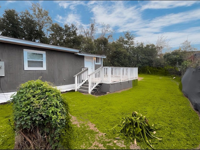 view of yard featuring a wooden deck