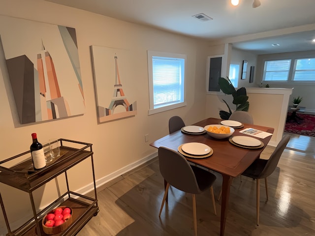 dining room with wood-type flooring