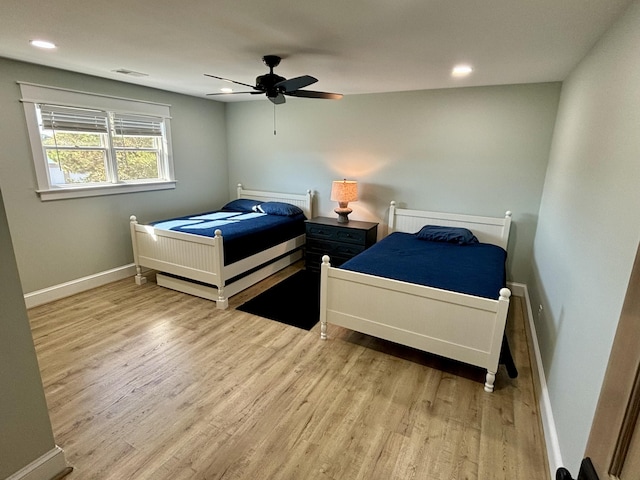 bedroom featuring ceiling fan and wood-type flooring