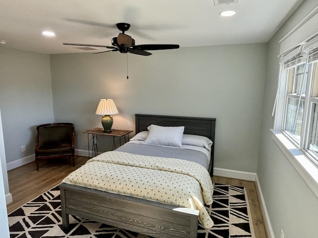 bedroom with hardwood / wood-style flooring and ceiling fan