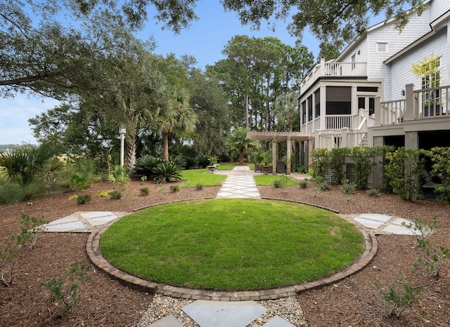 view of yard with a pergola and a sunroom