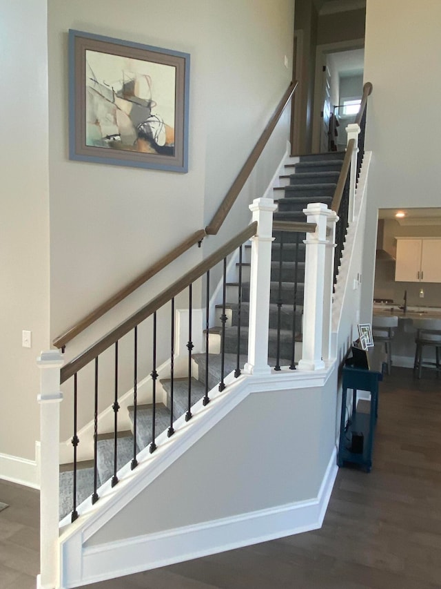 staircase with wood-type flooring