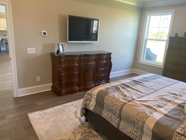 bedroom with wood-type flooring