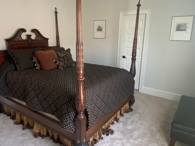 bedroom featuring light colored carpet