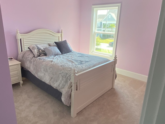 bedroom with light colored carpet