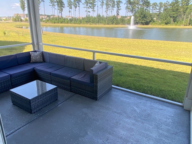 unfurnished sunroom featuring a water view