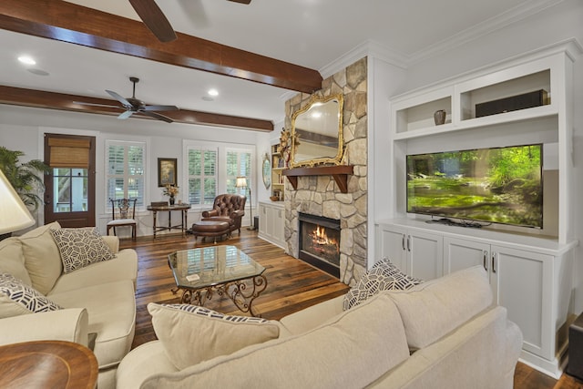 1193 River Rd, Johns Island, SC 29455 - living room with ceiling fan, dark wood finished floors, crown molding, a stone fireplace, and beamed ceiling