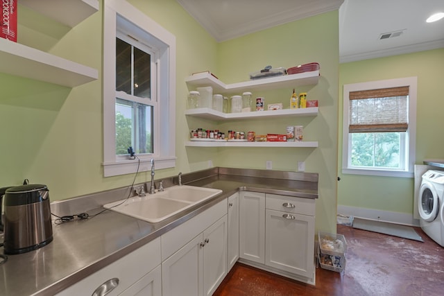 1193 River Rd, Johns Island, SC 29455 - kitchen featuring stainless steel counters, washer / dryer, a sink, white cabinetry, and ornamental molding