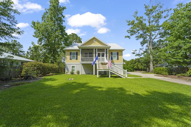 1193 River Rd, Johns Island, SC 29455 - beach home featuring a sunroom, stairs, and a ceiling fan