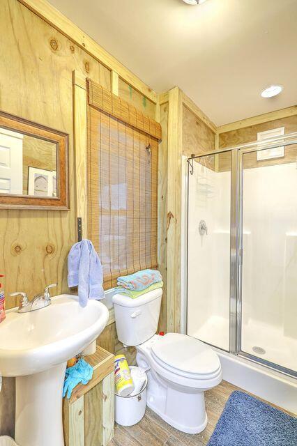 1193 River Rd, Johns Island, SC 29455 - bathroom with toilet, a shower stall, and wood finished floors
