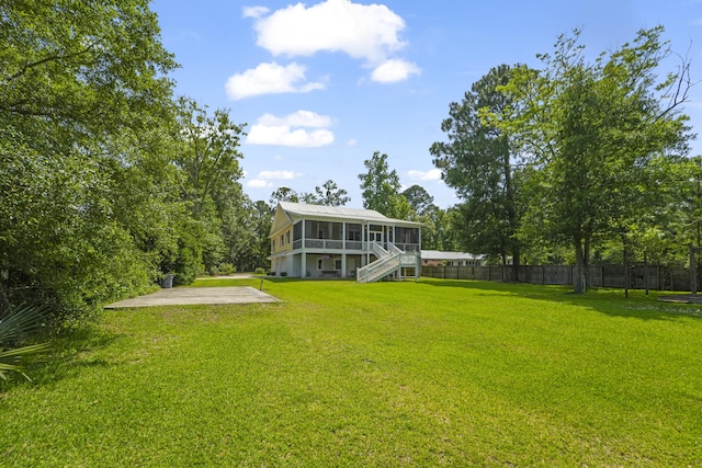1193 River Rd, Johns Island, SC 29455 - view of yard featuring a sunroom, a patio, and stairway
