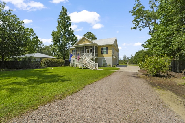 1193 River Rd, Johns Island, SC 29455 - view of front of property featuring stairway, gravel driveway, metal roof, and covered porch