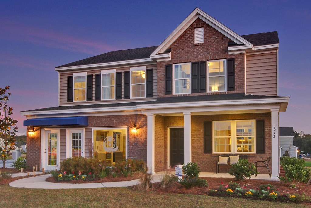 traditional-style home with brick siding