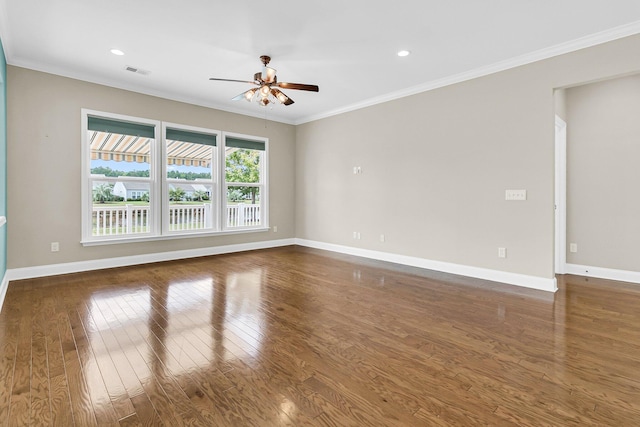 unfurnished room featuring ceiling fan, dark hardwood / wood-style floors, and crown molding