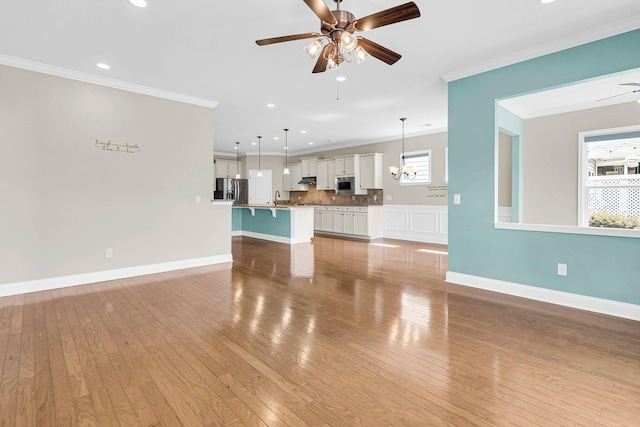 unfurnished living room with light hardwood / wood-style flooring, ceiling fan, and plenty of natural light