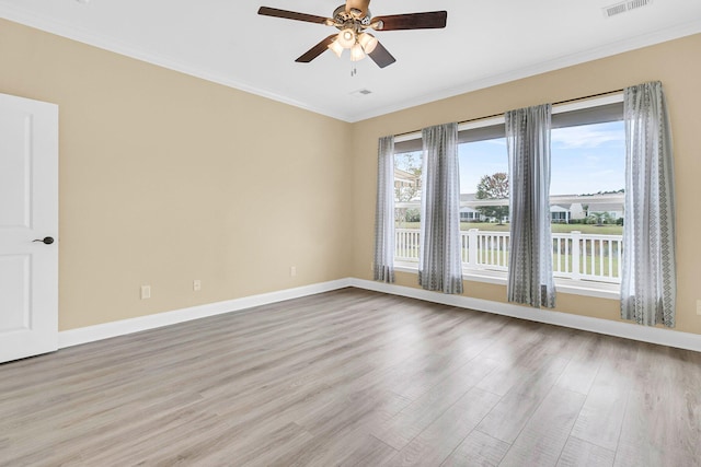 unfurnished room with light wood-type flooring, ornamental molding, and ceiling fan