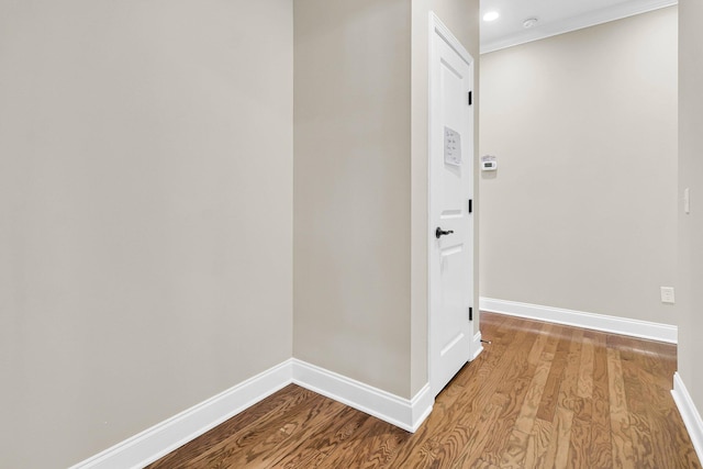 interior space featuring ornamental molding and light wood-type flooring