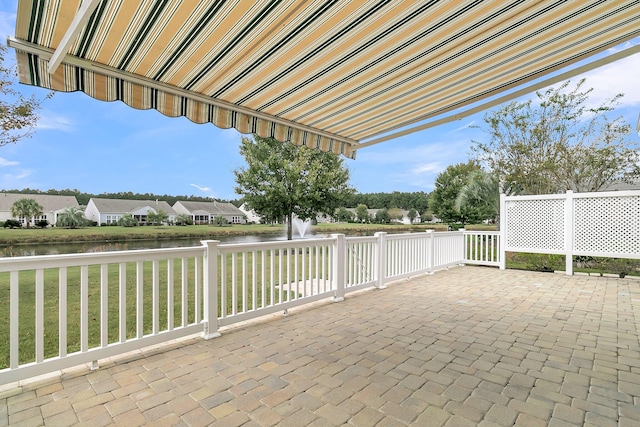 view of patio featuring a water view