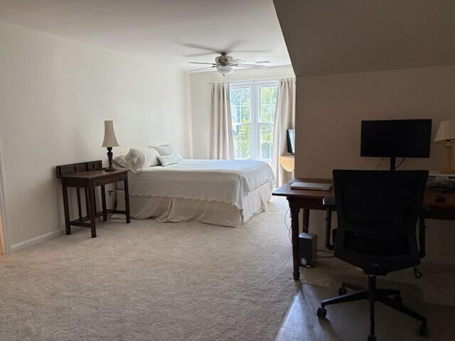 bedroom with carpet floors and a ceiling fan