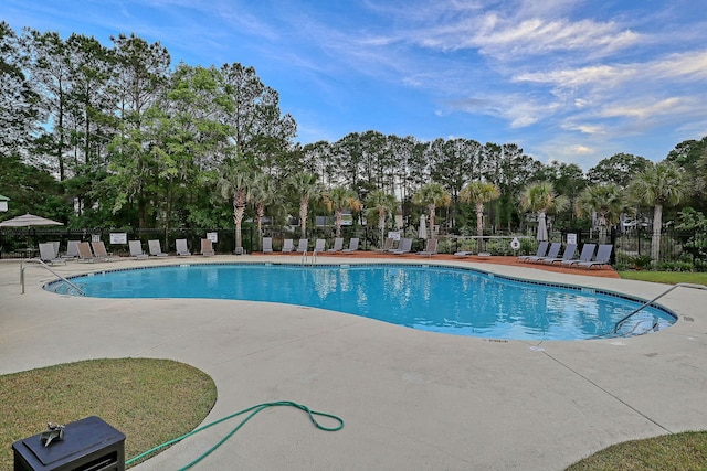 view of pool featuring a patio area