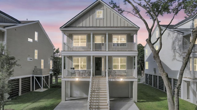 1304 Lieben Rd, Mount Pleasant, SC 29466 - back of property with board and batten siding, stairs, covered porch, a balcony, and a garage