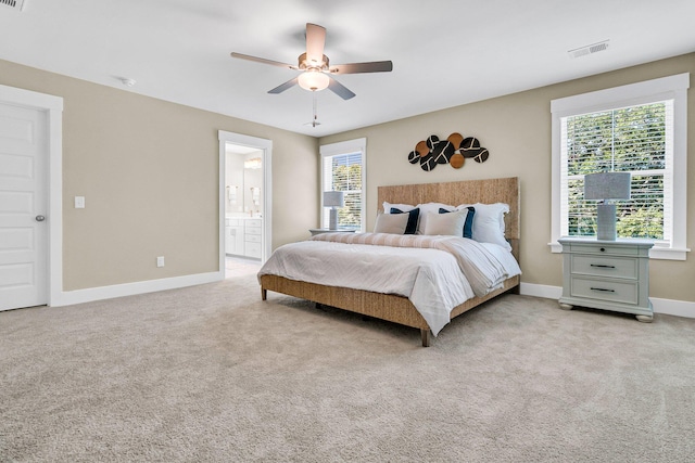 1304 Lieben Rd, Mount Pleasant, SC 29466 - bedroom featuring light colored carpet, baseboards, a ceiling fan, and ensuite bath