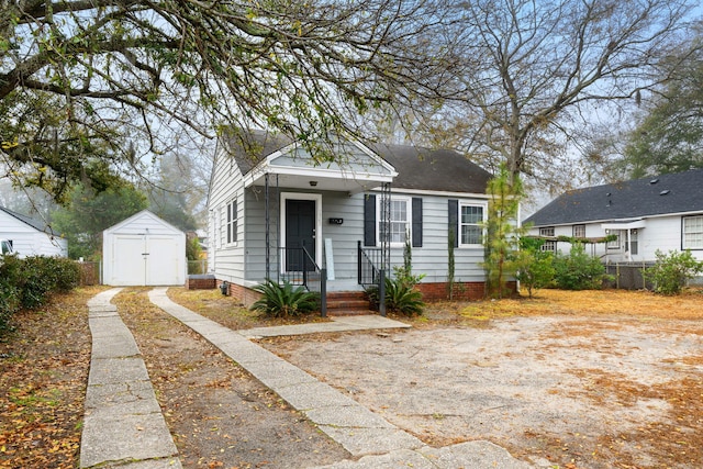 bungalow-style house with a shed