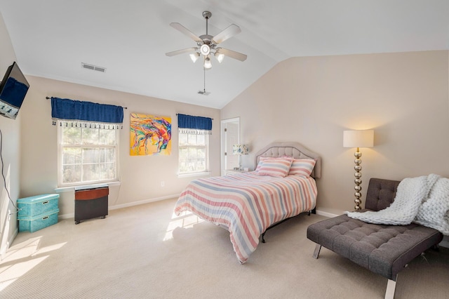 carpeted bedroom featuring baseboards, multiple windows, vaulted ceiling, and visible vents