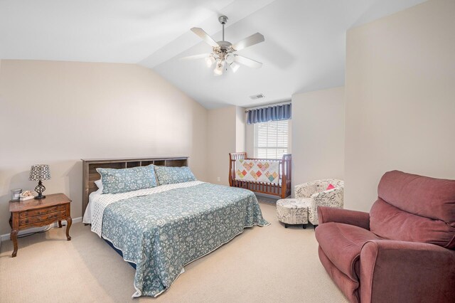 bedroom featuring lofted ceiling, carpet flooring, baseboards, ceiling fan, and visible vents