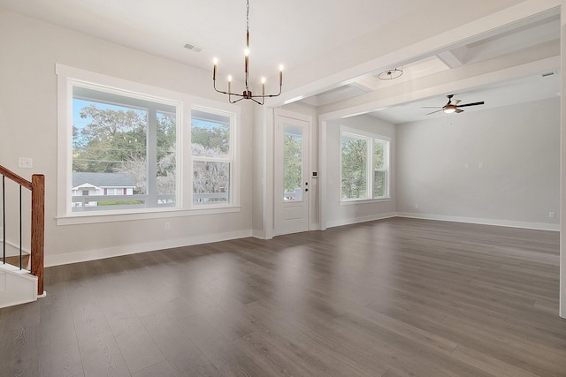 unfurnished living room featuring a chandelier, baseboards, stairs, and dark wood-style floors