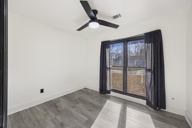 empty room with ceiling fan and wood-type flooring