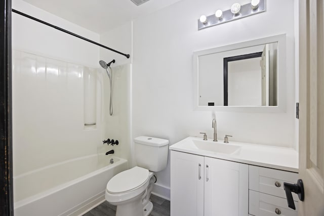 full bathroom featuring wood-type flooring, shower / tub combination, toilet, and vanity