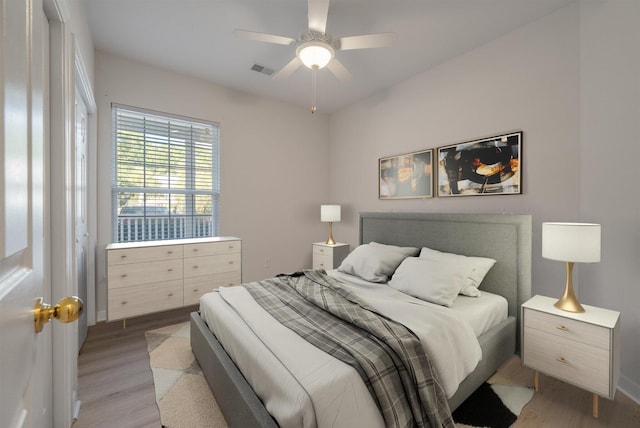 bedroom featuring hardwood / wood-style floors and ceiling fan