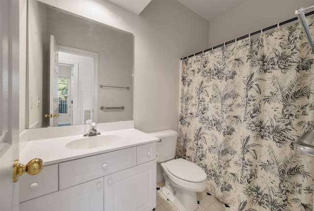 bathroom featuring toilet, a shower with curtain, vanity, and tile patterned flooring