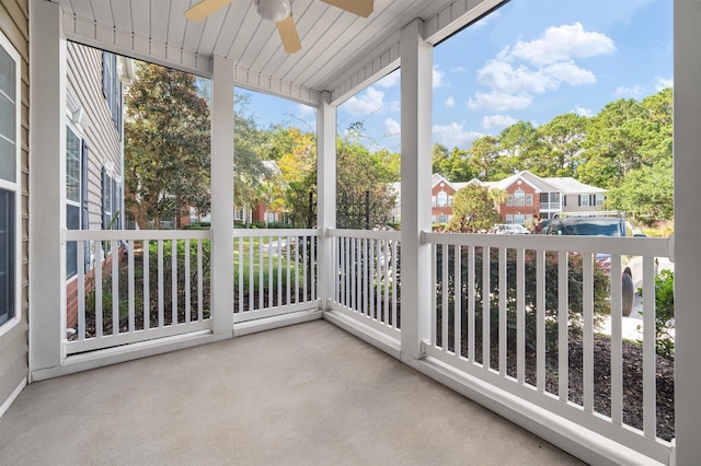 sunroom featuring ceiling fan and wooden ceiling