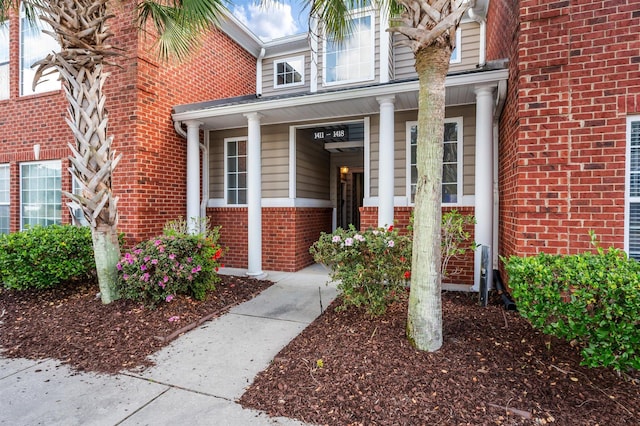 entrance to property featuring covered porch