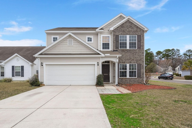 traditional-style home with a front lawn, an attached garage, brick siding, and driveway