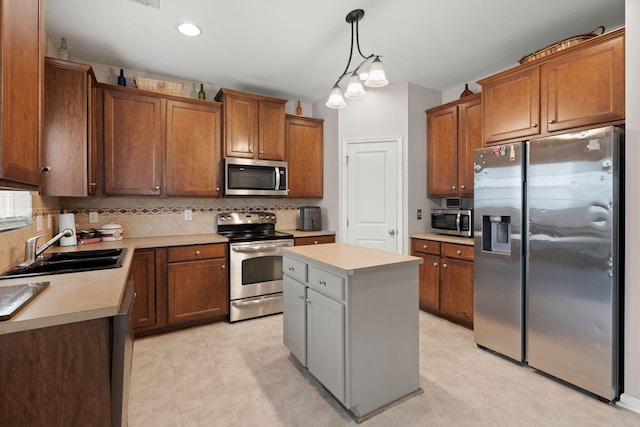 kitchen with a sink, light countertops, decorative backsplash, and stainless steel appliances