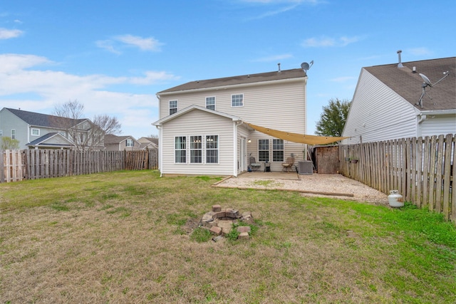 rear view of property featuring a fenced backyard, cooling unit, a patio, and a yard