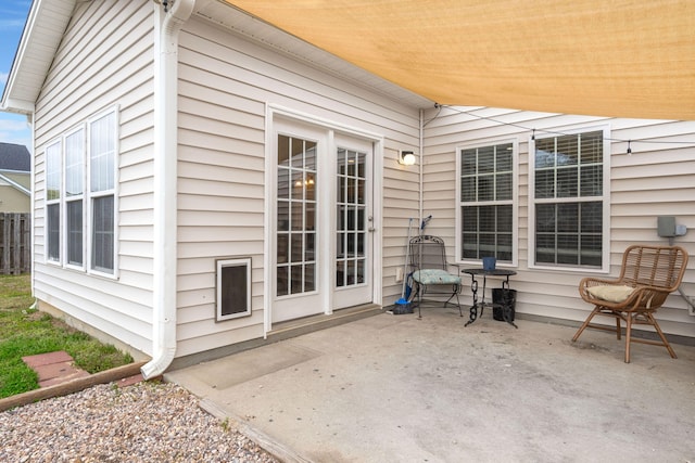 view of patio / terrace featuring fence