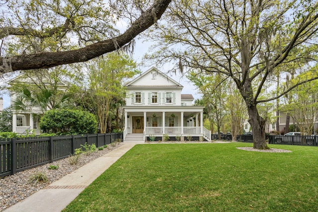 exterior space with covered porch and a lawn