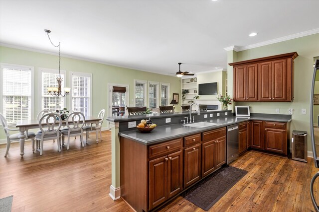 1119 Bruton Blvd, Moncks Corner, SC 29461 - kitchen featuring a sink, dishwasher, dark countertops, ornamental molding, and a peninsula