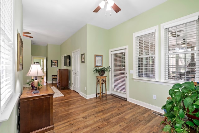 1119 Bruton Blvd, Moncks Corner, SC 29461 - foyer featuring a ceiling fan, wood finished floors, and baseboards